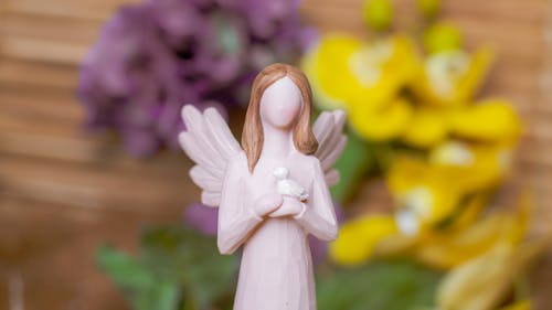 Free A Close-Up Shot of an Angel Figurine Stock Photo