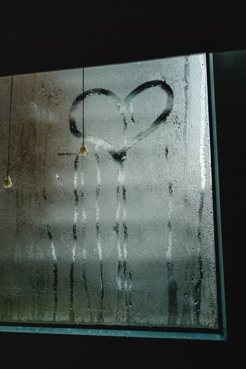 Free Heart Shape Drawn on Wet Window Stock Photo