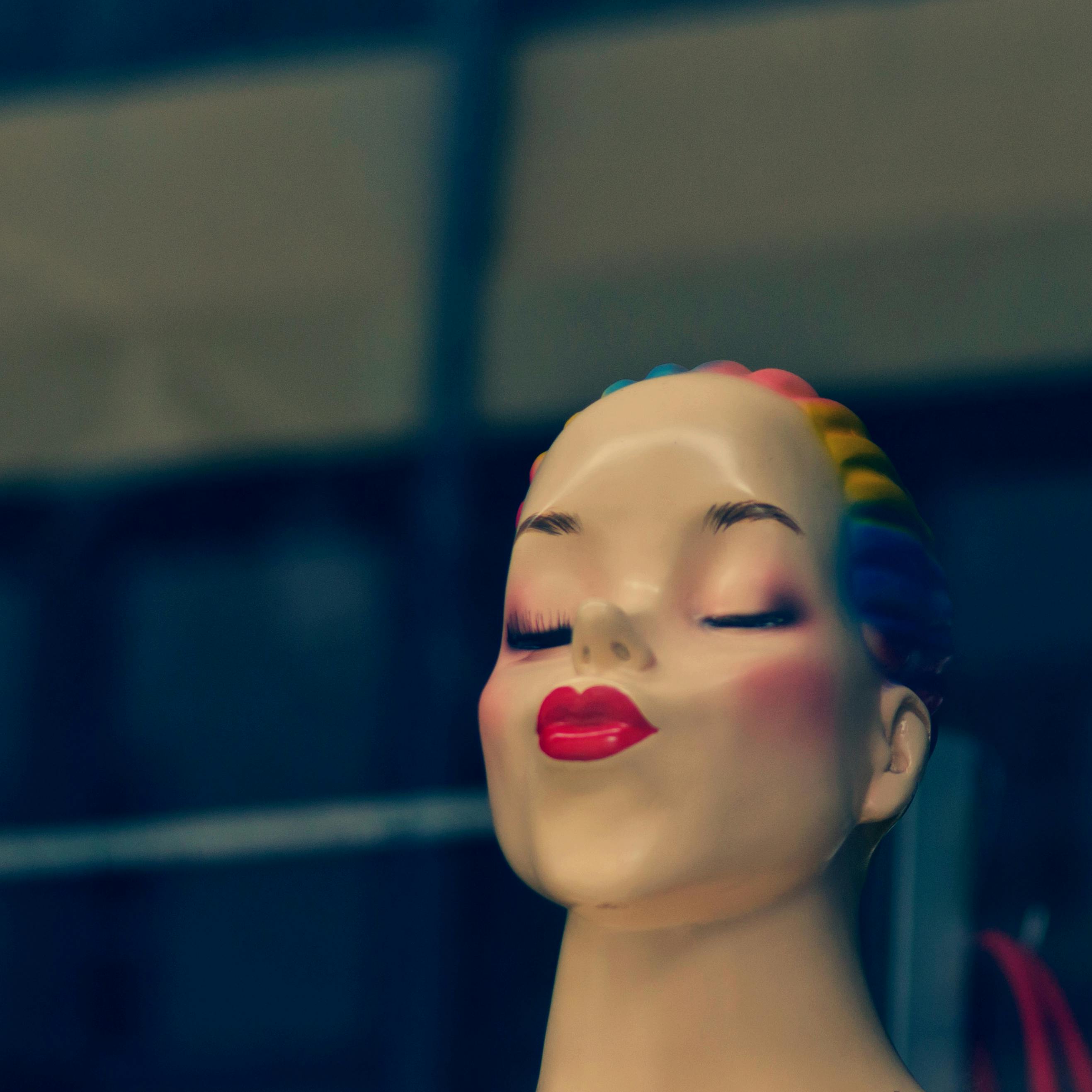 Woman With Blue and Red Face Paint · Free Stock Photo