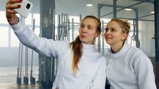 2 Women in White Long Sleeve Shirt