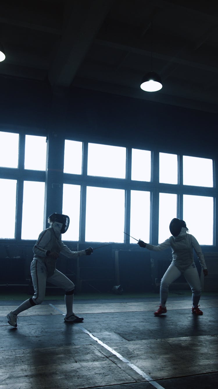 Two Women Doing Fencing 