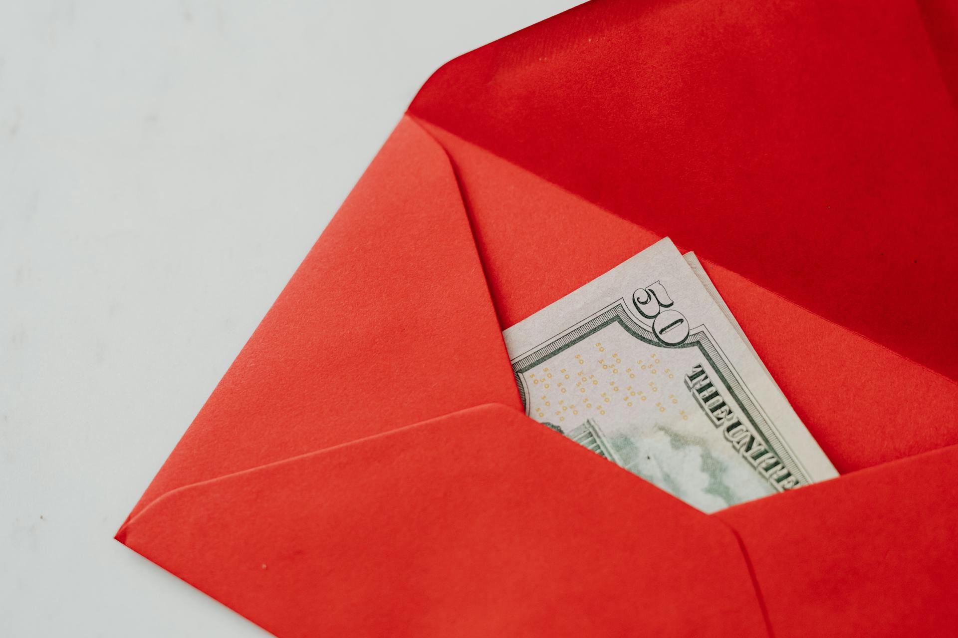 Fifty Dollars Bill in a Red Envelope