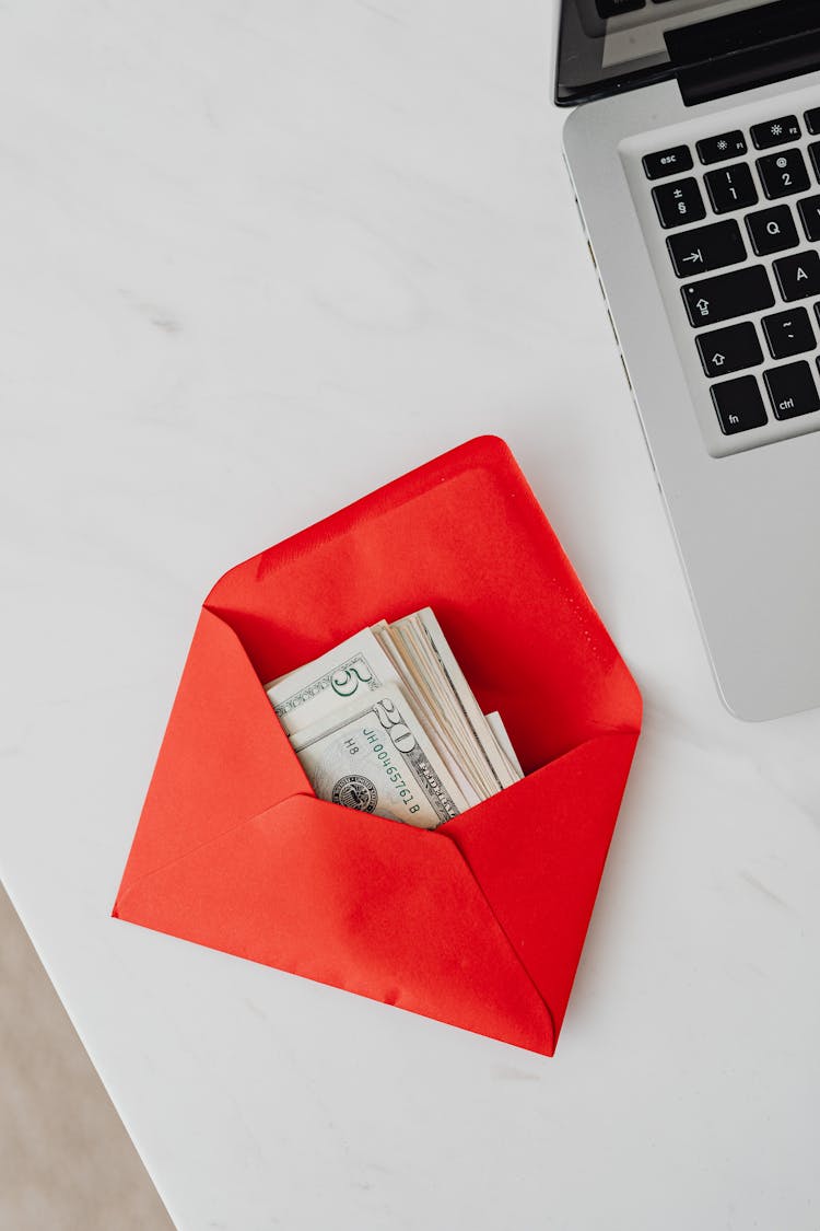 Envelope With Money On Office Table