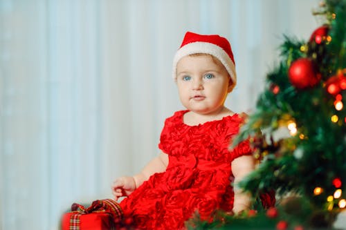 Free A Young Girl Wearing a Christmas Hat Stock Photo