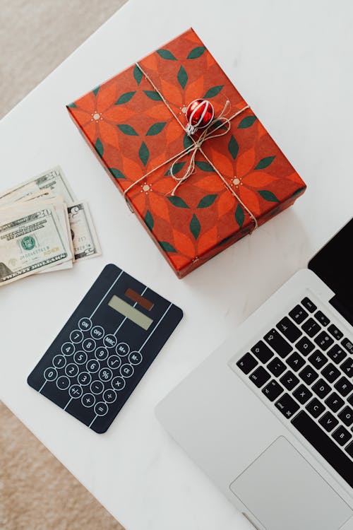 Wrapped Present and Money on Table