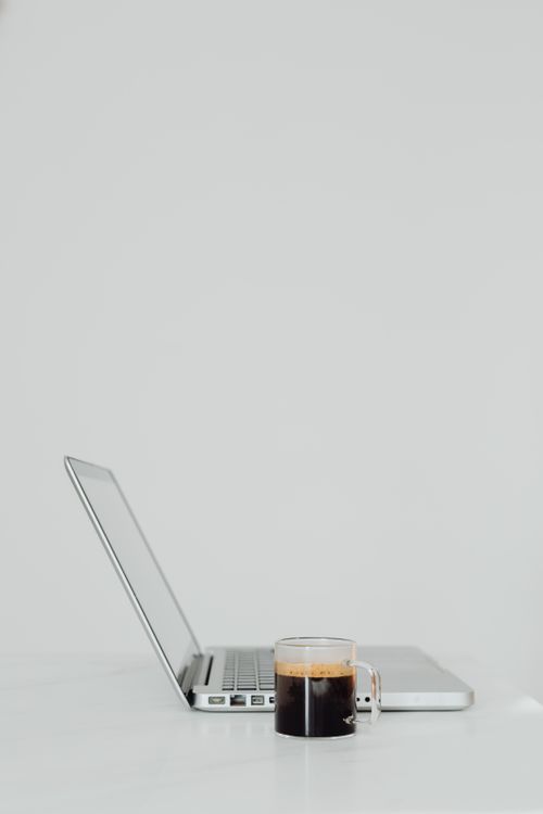 Laptop and coffee on a minimal desk, Kaboompics on Pexels