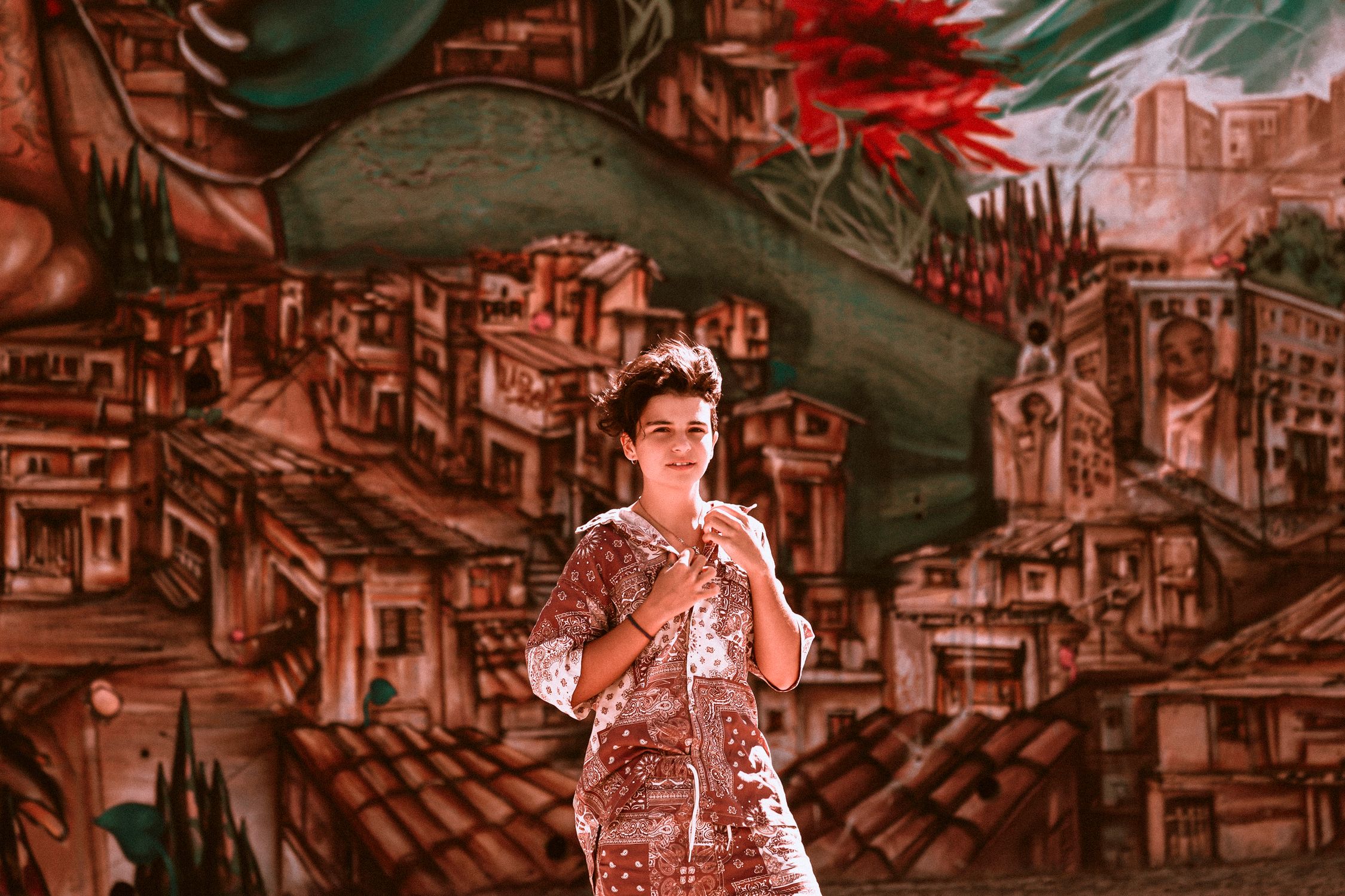 A Girl Standing in Front of a Mural Painting · Free Stock Photo