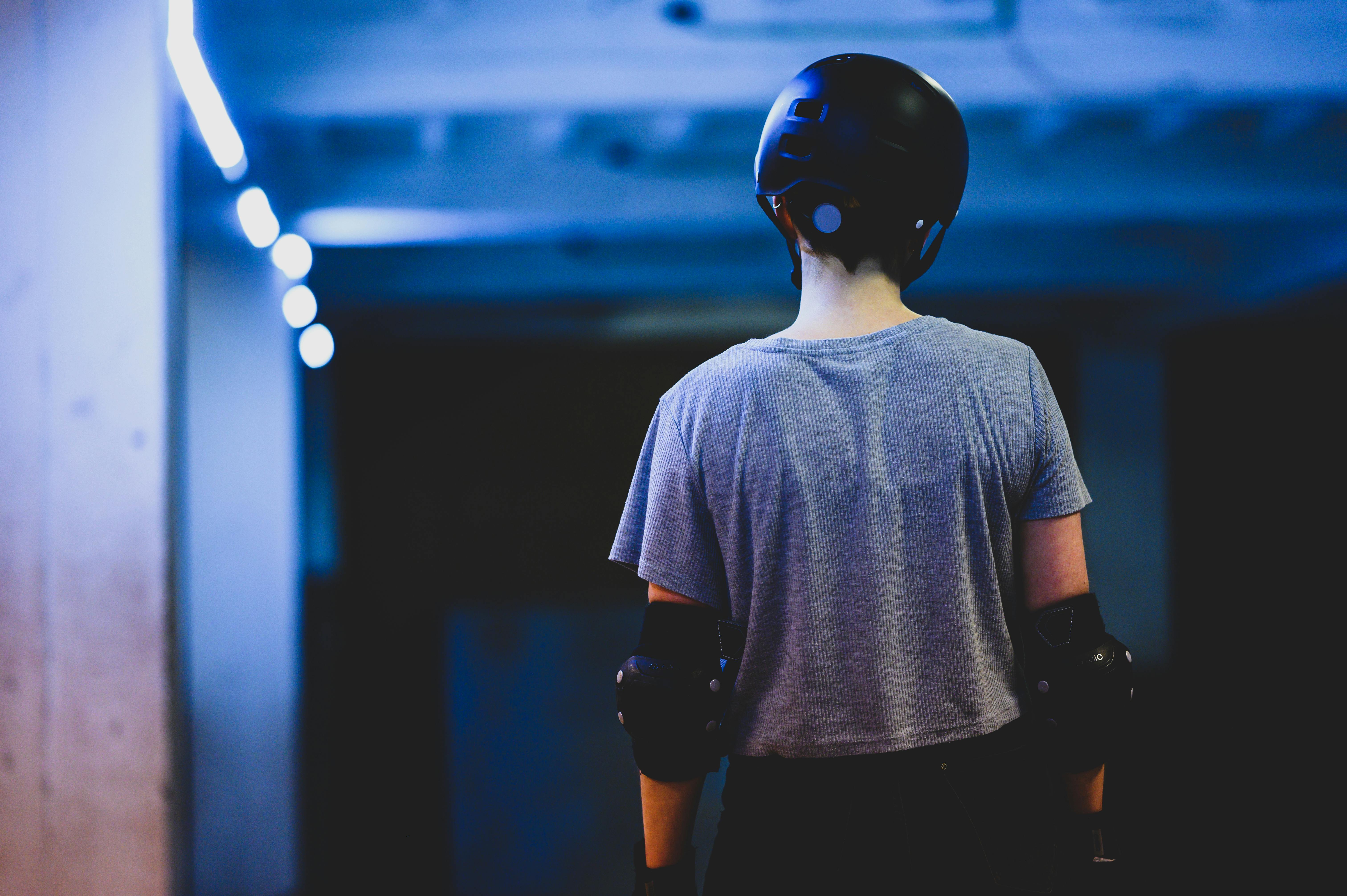 Man in Gray Crew Neck T-shirt Wearing Black Helmet · Free Stock Photo