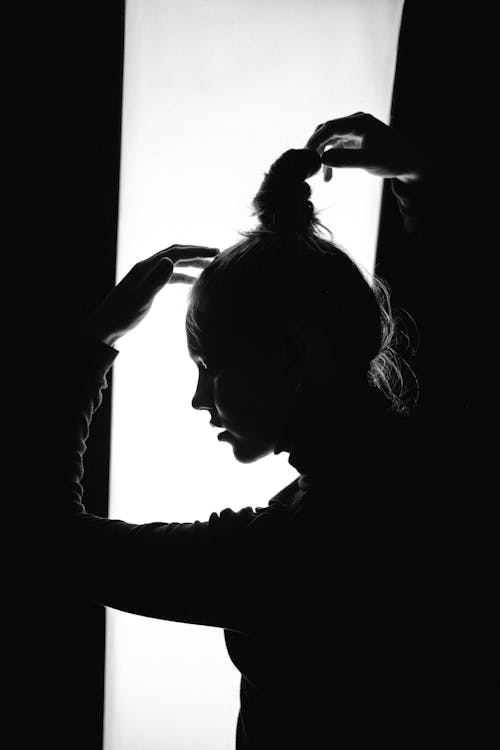 Free A Woman Touching Her Hair Stock Photo