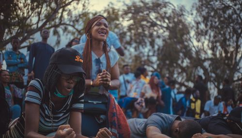 Free A vibrant and passionate scene of a diverse group of people protesting outdoors. Stock Photo