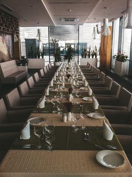 Stylish dining area set for a formal gathering with neatly arranged tableware.