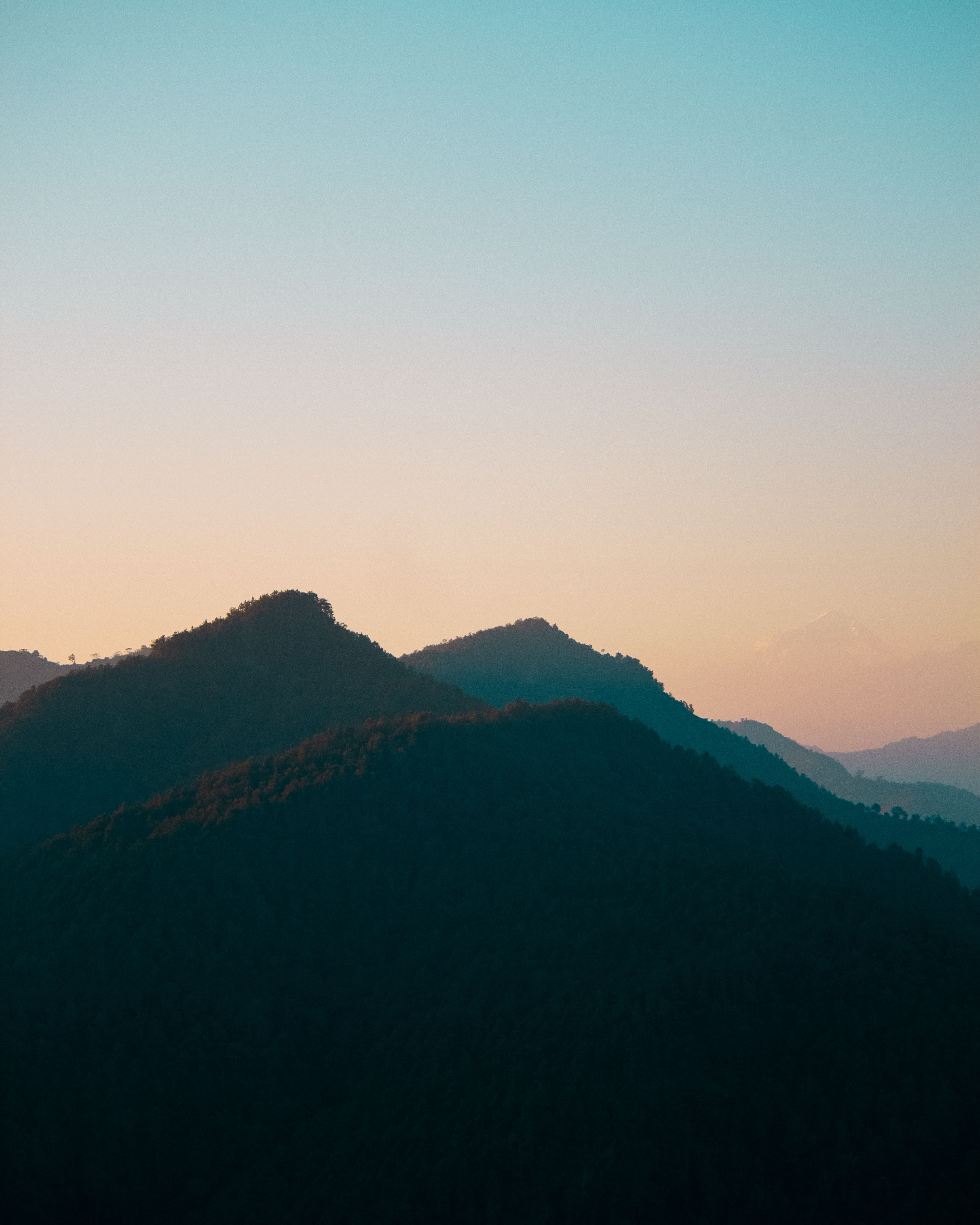 Silhouette of Mountains during Sunset · Free Stock Photo