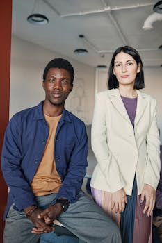 Professional colleagues in a sleek office space, showcasing diversity and collaboration.