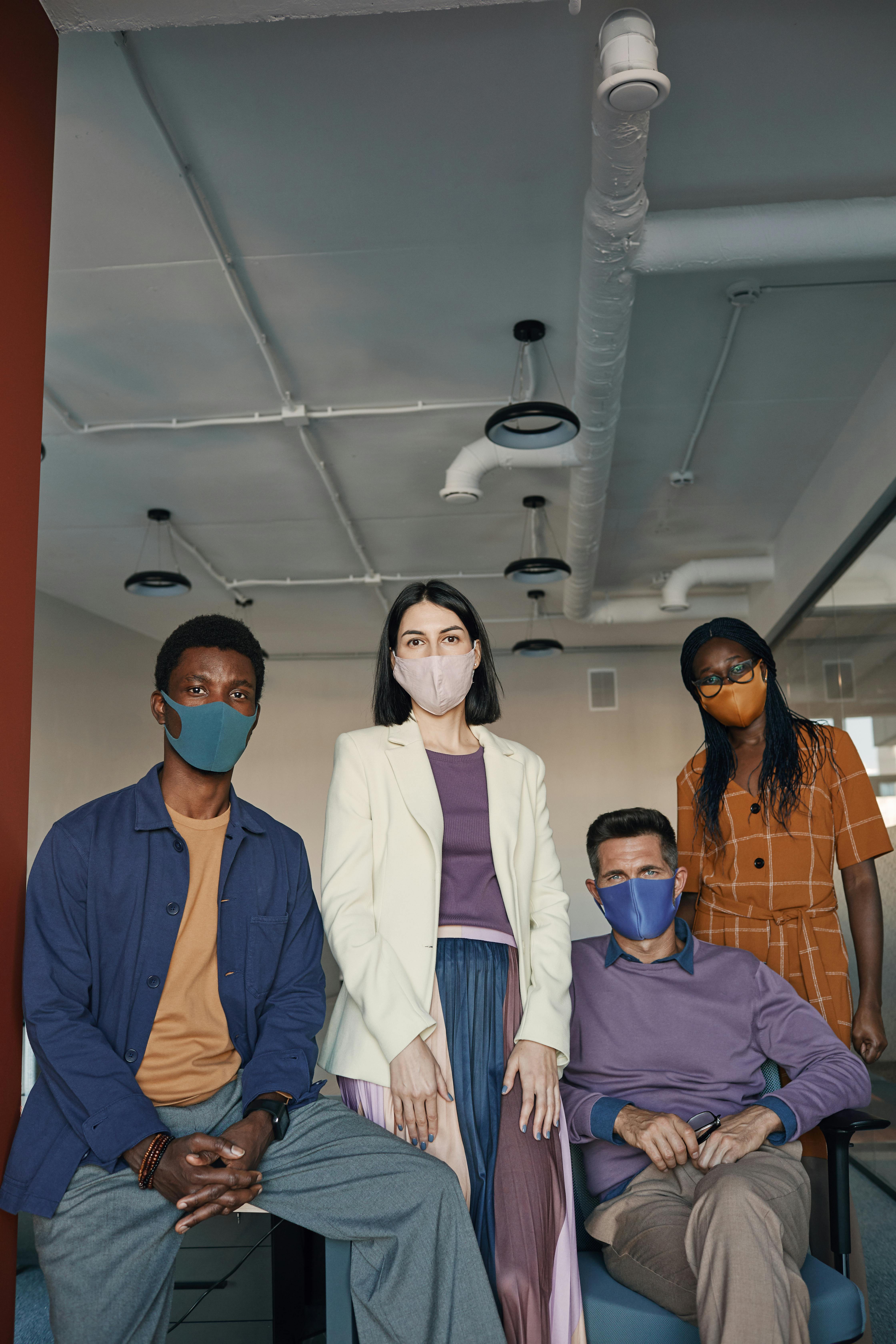 A diverse group of colleagues collaborating in an office environment, representing the importance of workplace policies