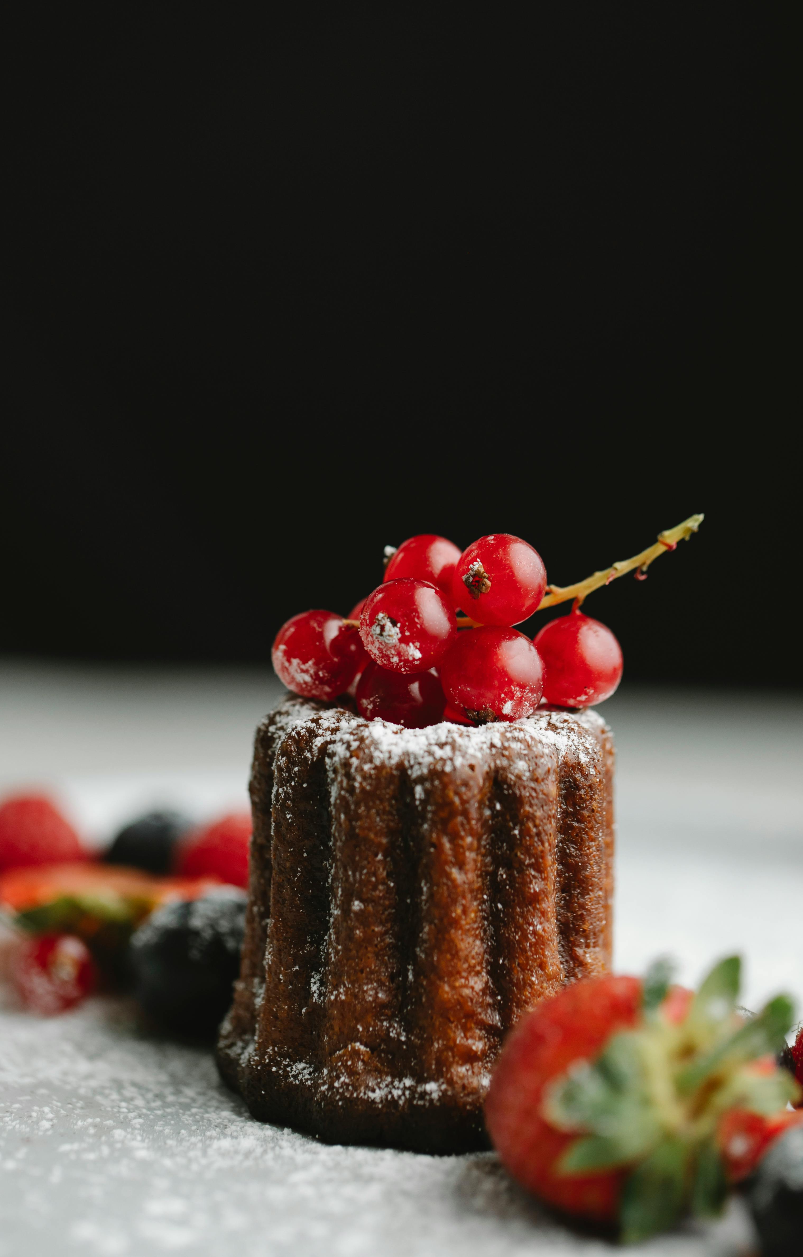 Tasty cake on black background · Free Stock Photo