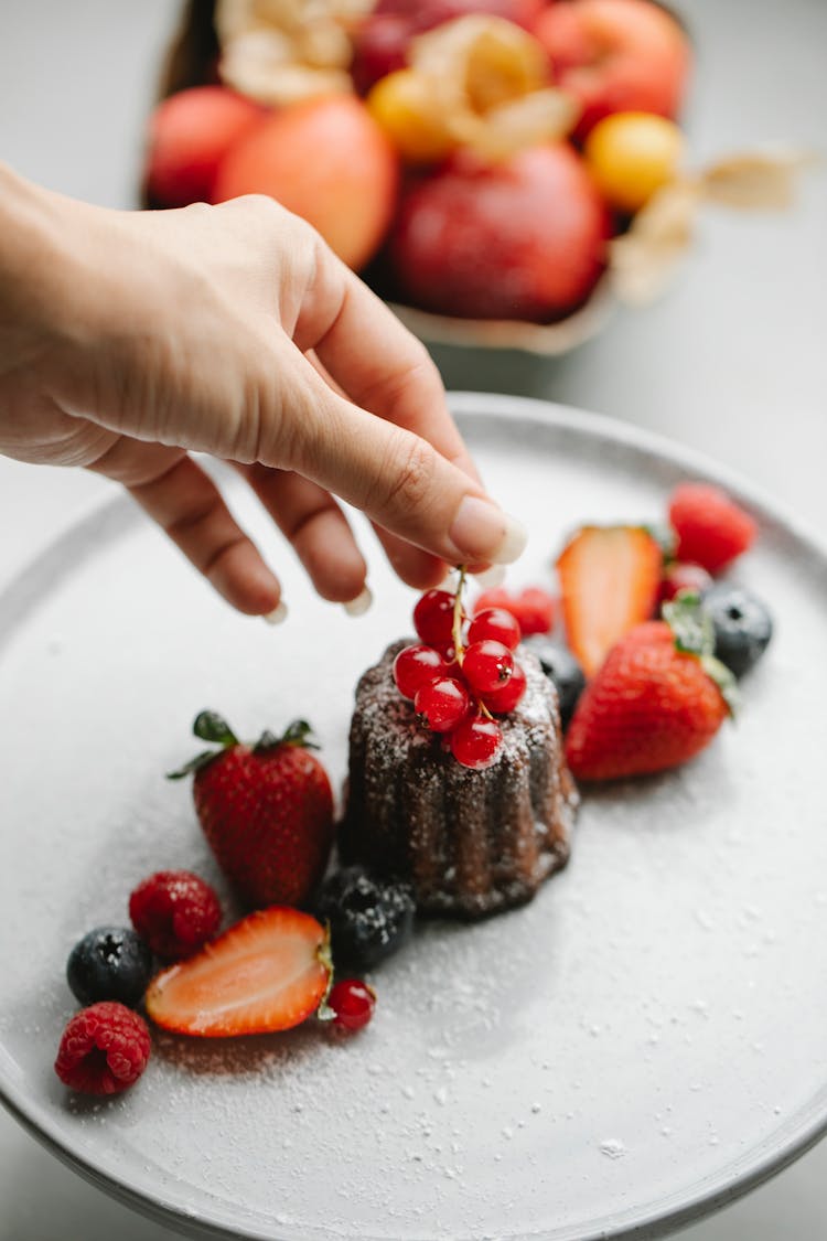 Crop Chef Serving Cake With Berries