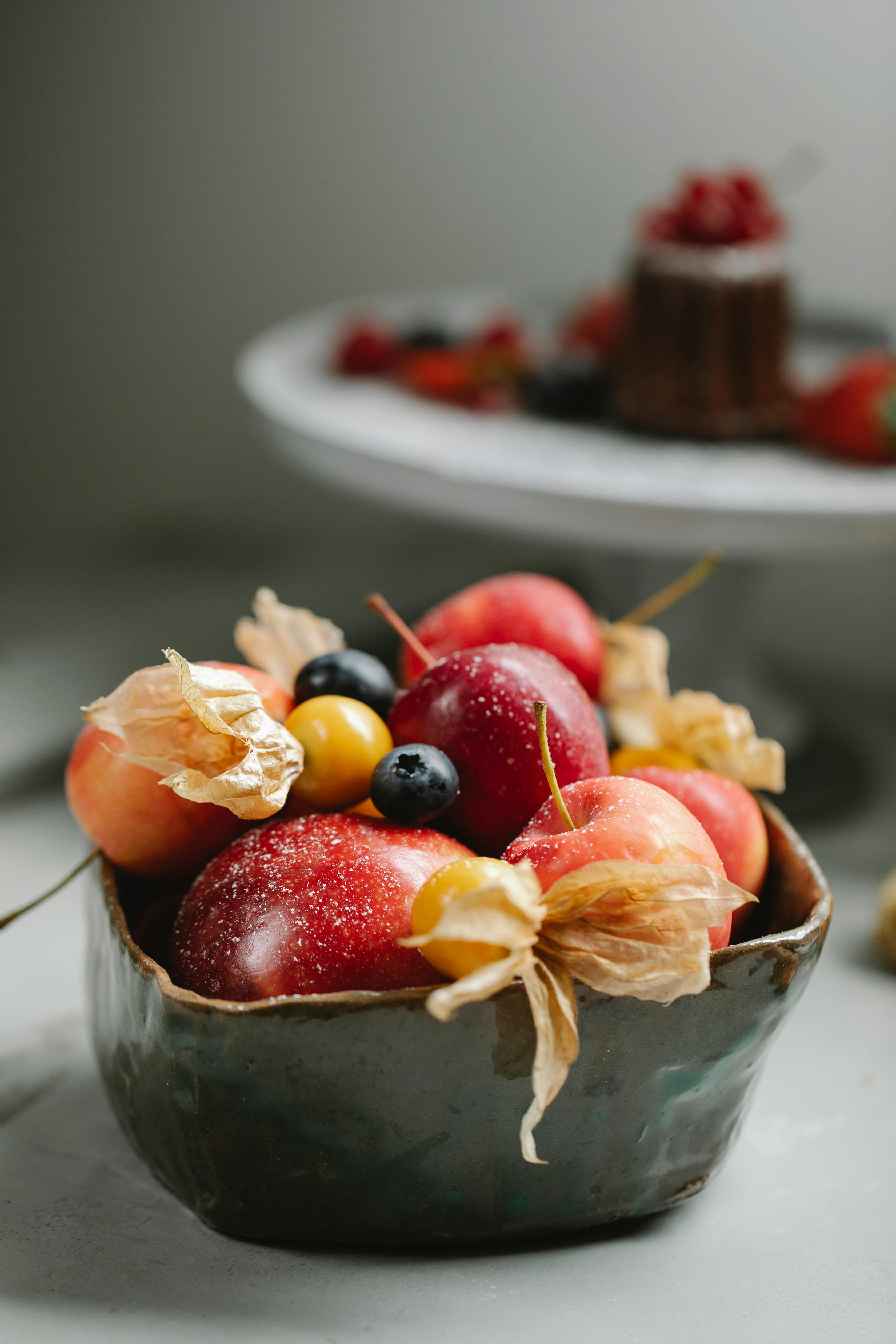 ripe fruits and berries in bowl