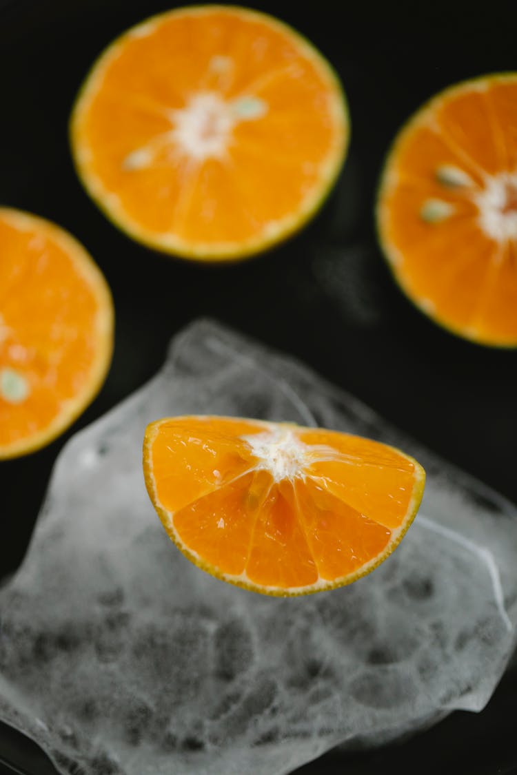 Sliced Healthy Citrus Fruit On Ice