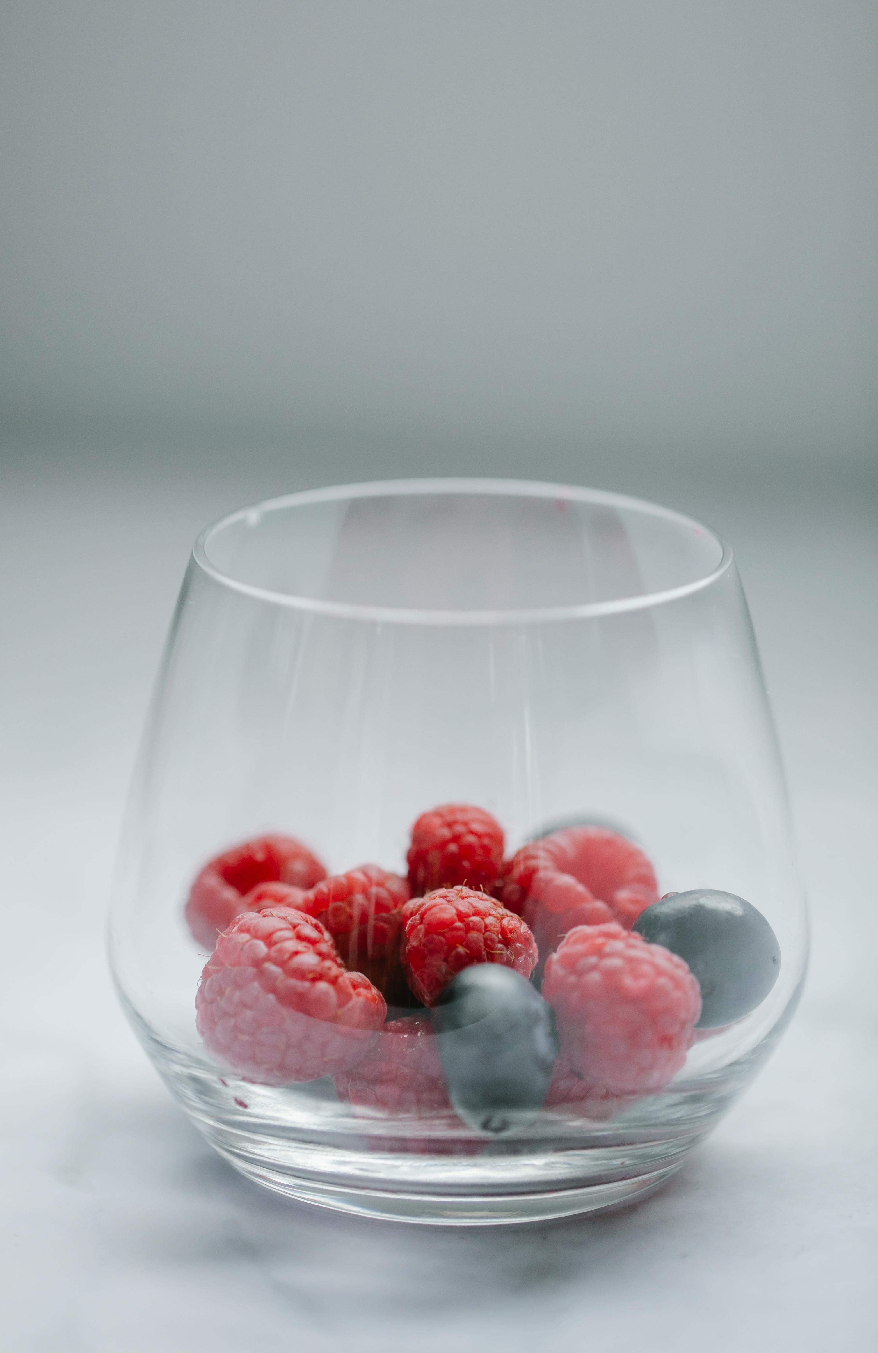 glass of fresh berries on table