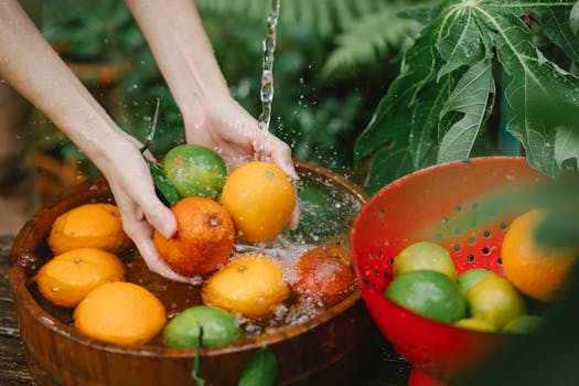 Woman washing fresh fruits in tropical orchard with the Quote "The gambling known as business looks with austere disfavor upon the business known as gambling." written on it and have average color value #6F5E39