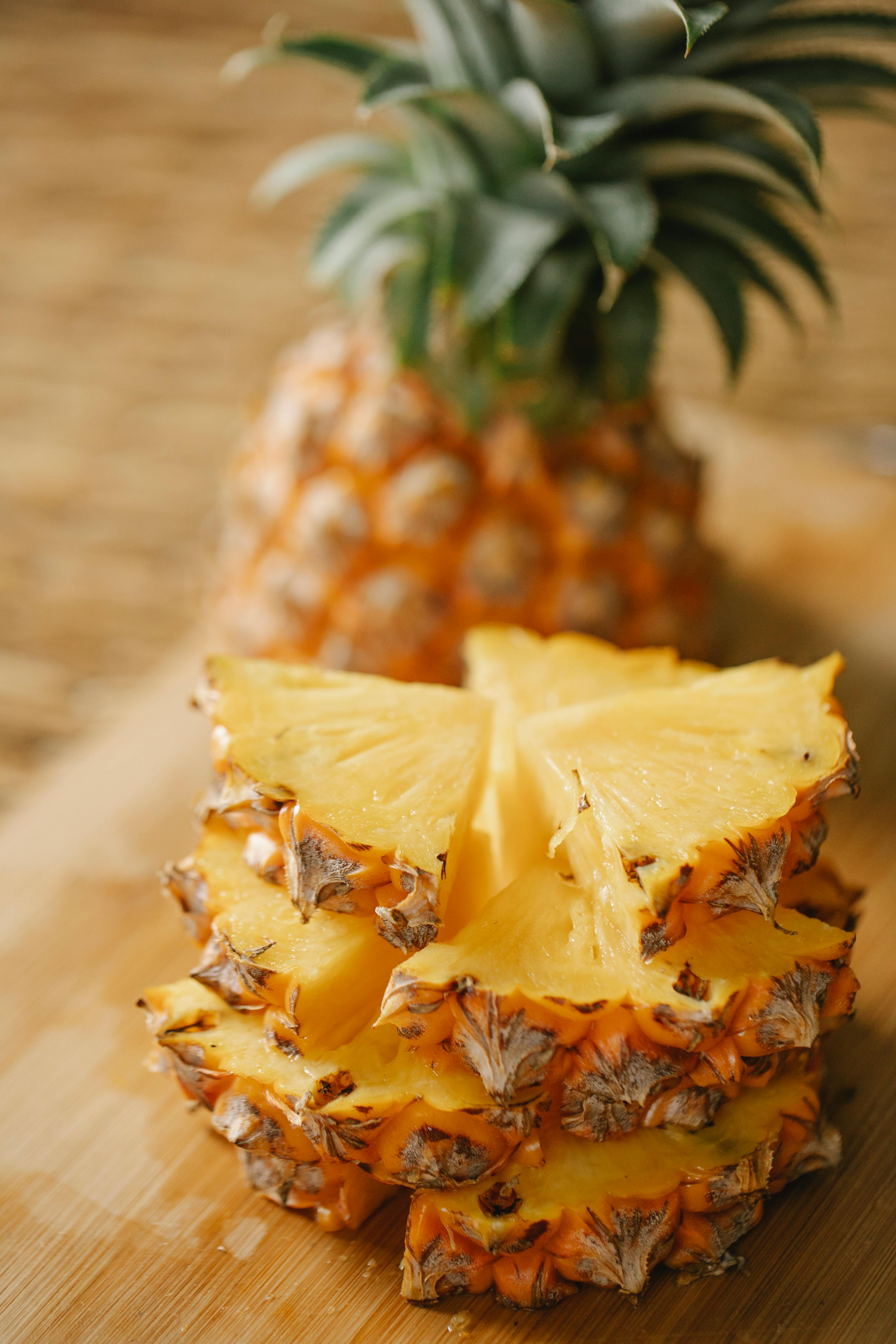 segments of pineapple arranged on board