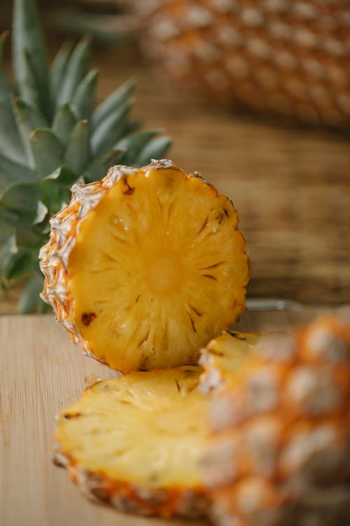 Sliced pineapple on cutting board