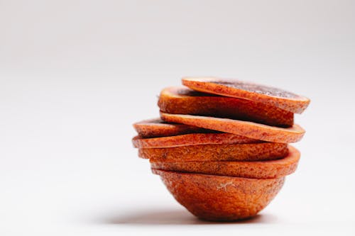 Slices of red orange on white background