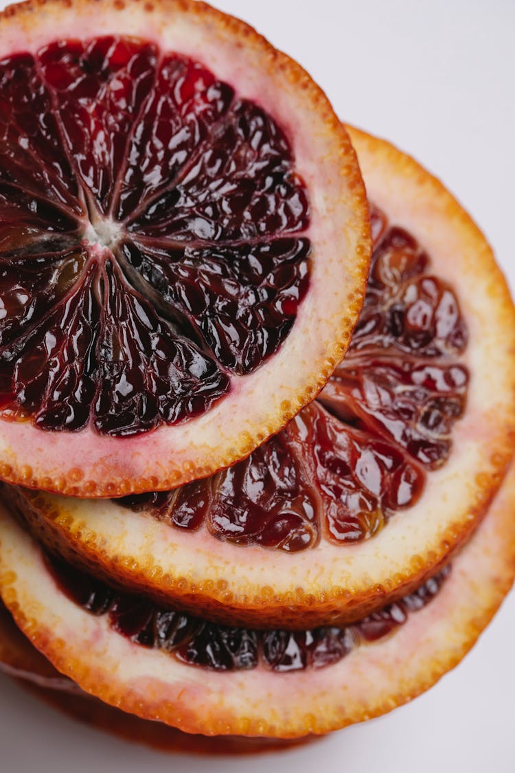 Sliced Red Orange On White Surface