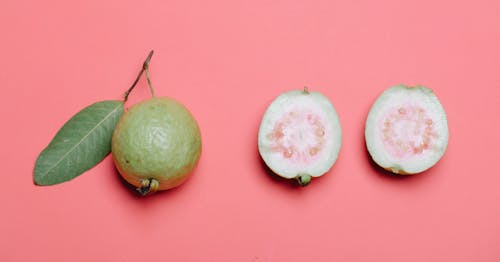 Whole and cut guava fruits