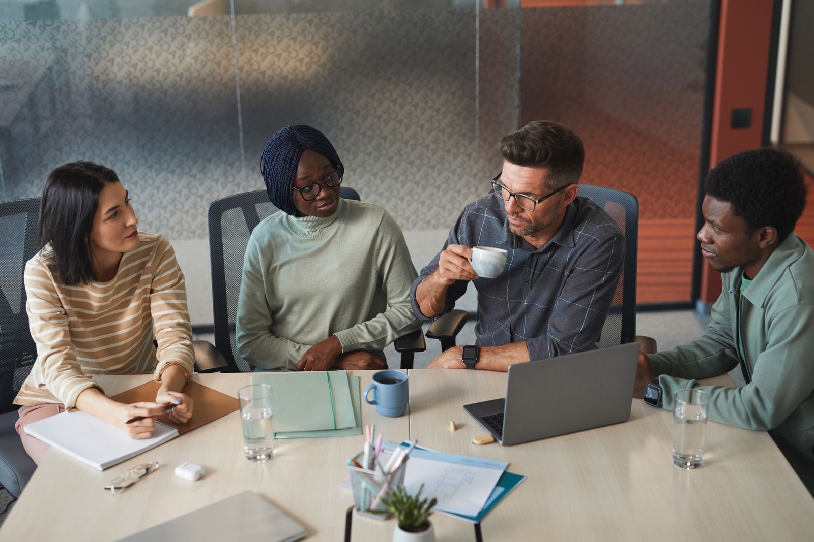 Business team collaborating around a meeting table
