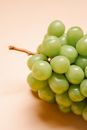 Ripe green grapes on table