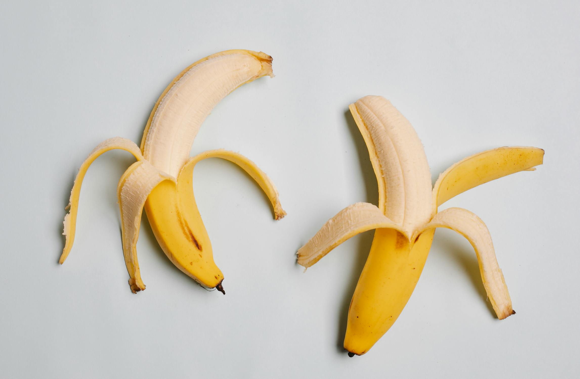Two peeled bananas