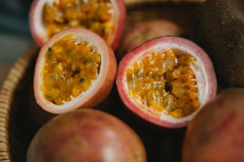 Ripe passion fruit in wicker bowl