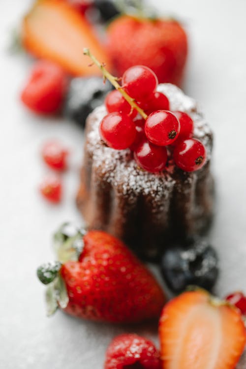 Red currant on delicious lava cake with berries
