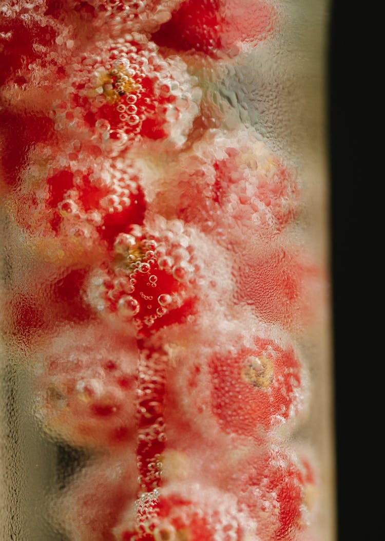 Delicious Red Currant In Glass Cup Filled With Water