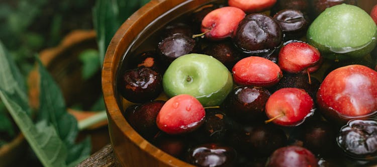 Ripe Fruits In Bowl In Forest