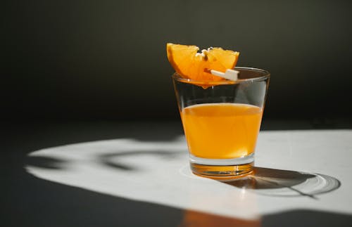 Glass of orange juice with orange slice