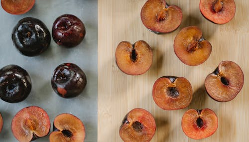 Ripe tasty plums on different backgrounds