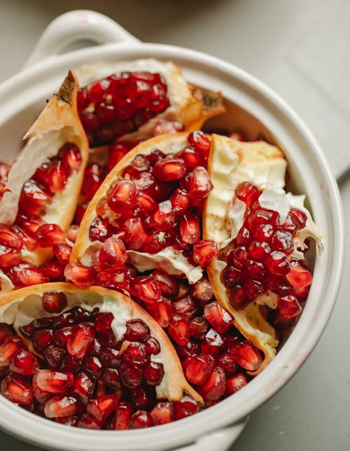 Slices of ripe pomegranate  in bowl