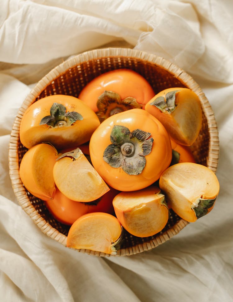 Whole And Cut Fruits Of Persimmons