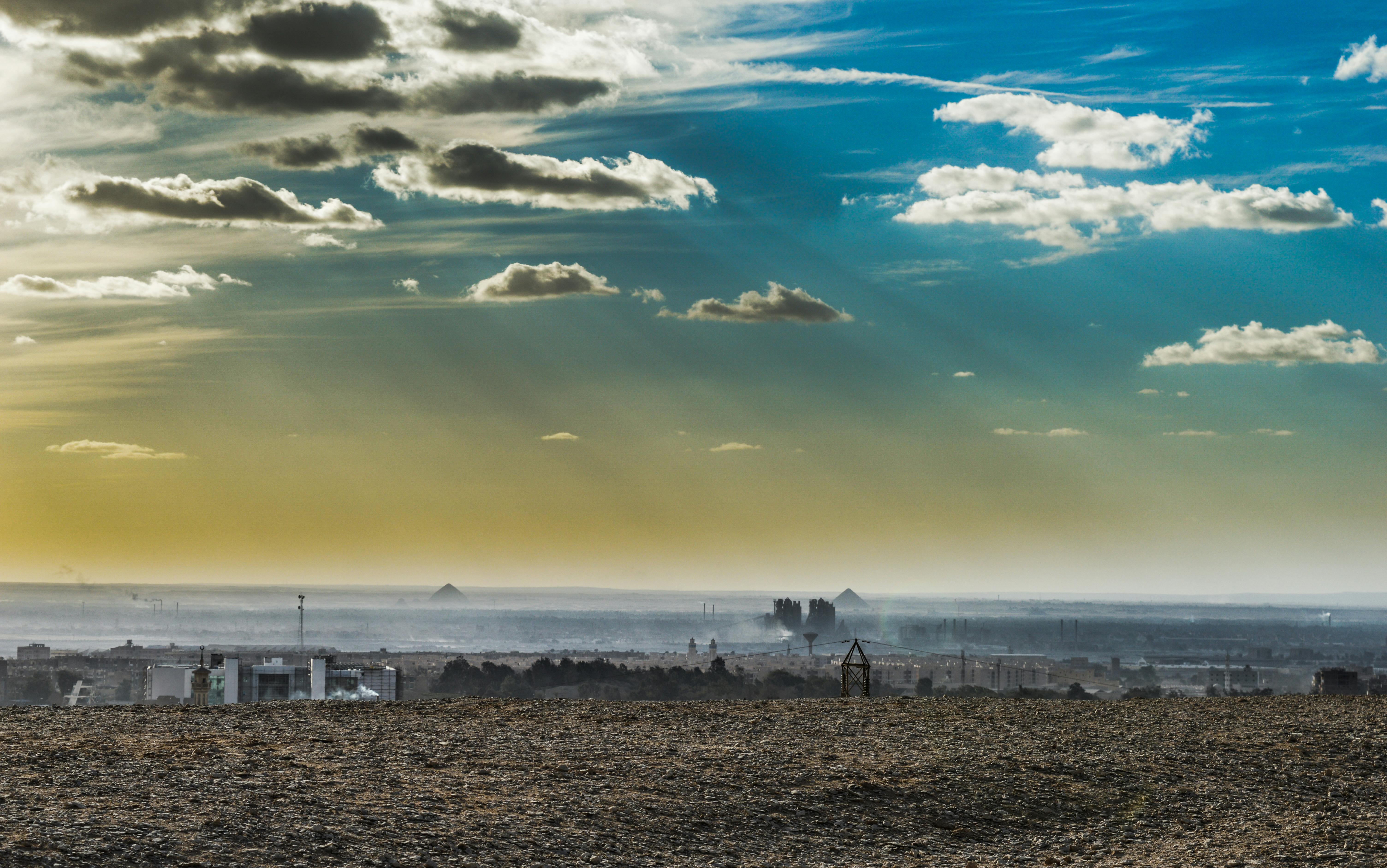 desert under sunny cloudy blue sky