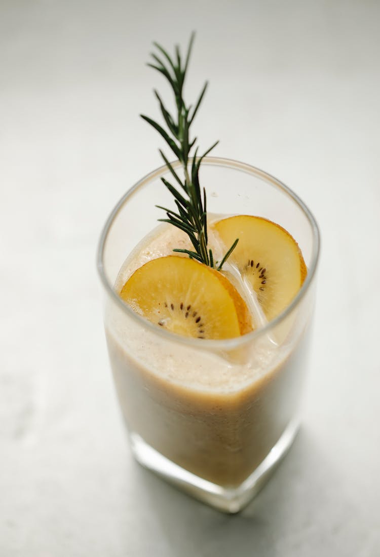 Glass Of Kiwi Smoothie On Table