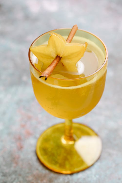 Glass of drink with carambola fruit