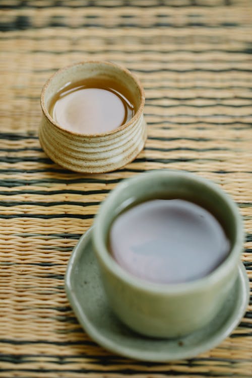 Free Oriental cups of natural tea on table Stock Photo