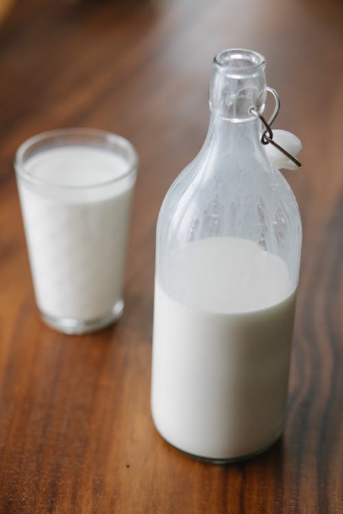 Free Bottle and glass of milk at home Stock Photo