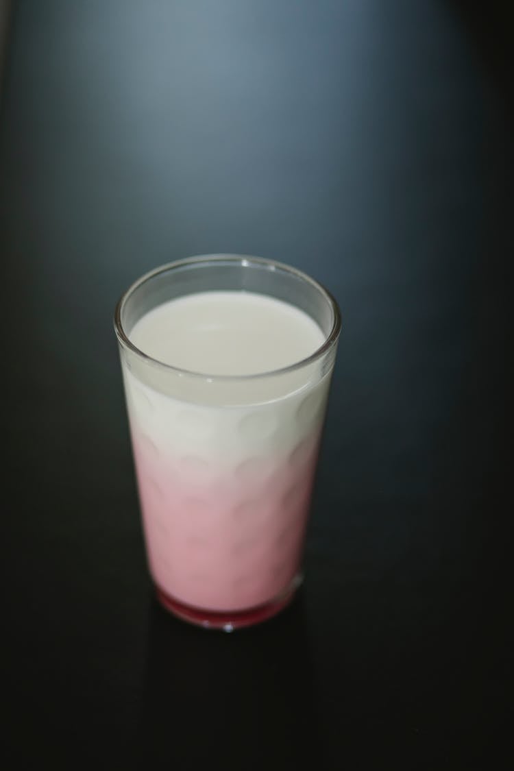 Delicious Smoothie In Glass On Gray Background