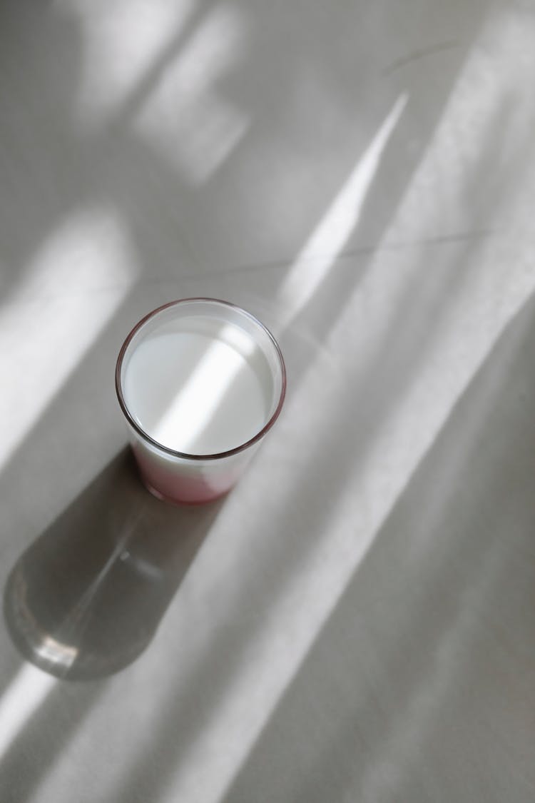 Glass Of Tasty Milkshake On Shiny Table