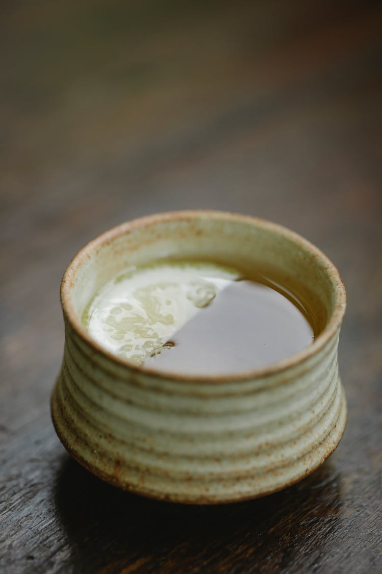 Cup Of Tea With Lemon Slice On Table