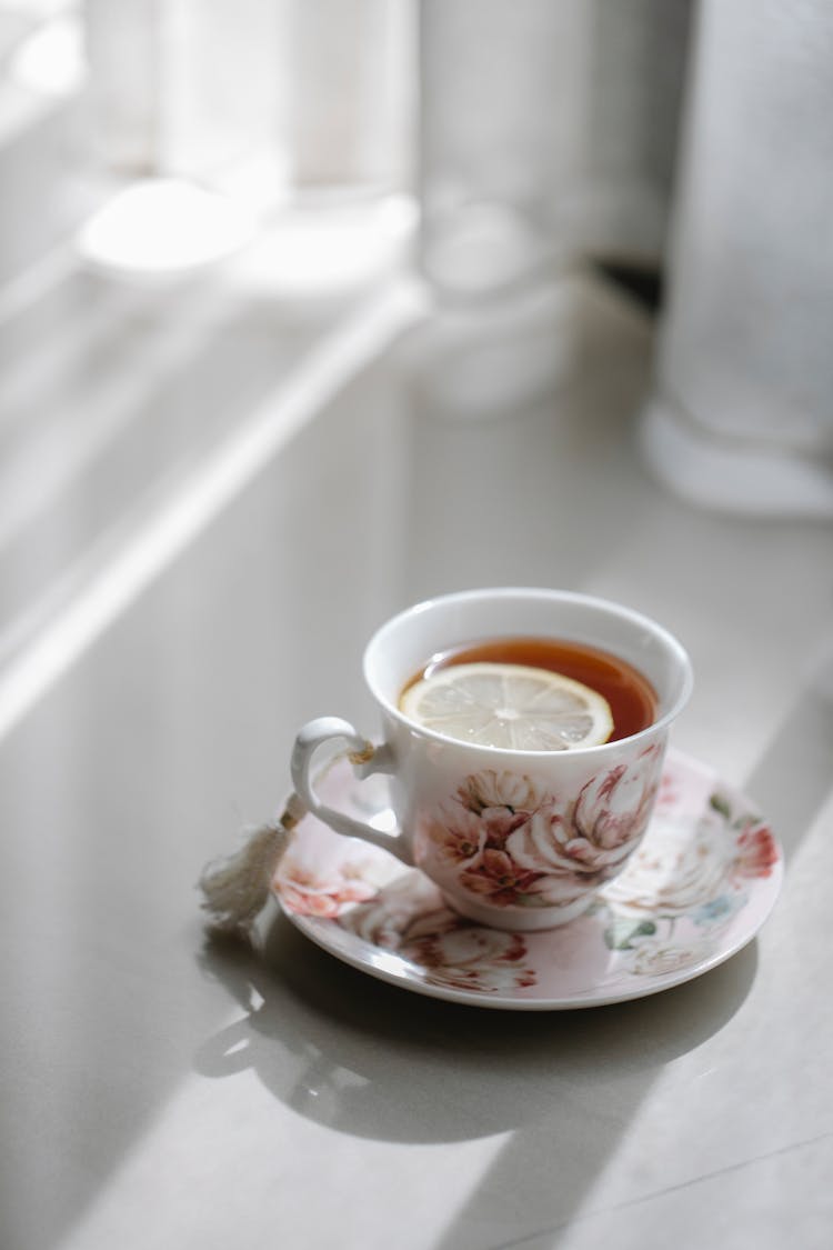 Ornamental Porcelain Cup Of Tea With Lemon At Home