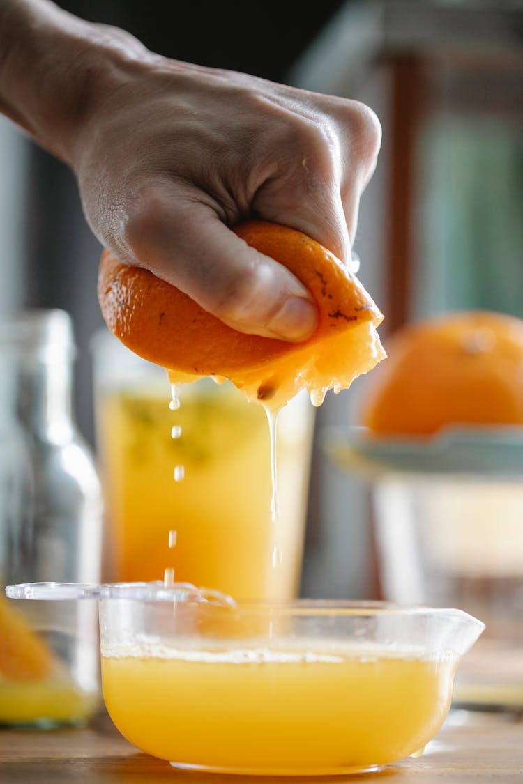 Crop Person Preparing Fresh Orange Juice